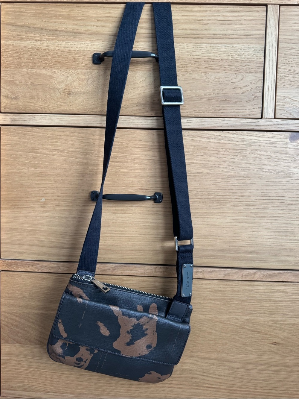 Woman’s Black and Brown Crossbody Bag